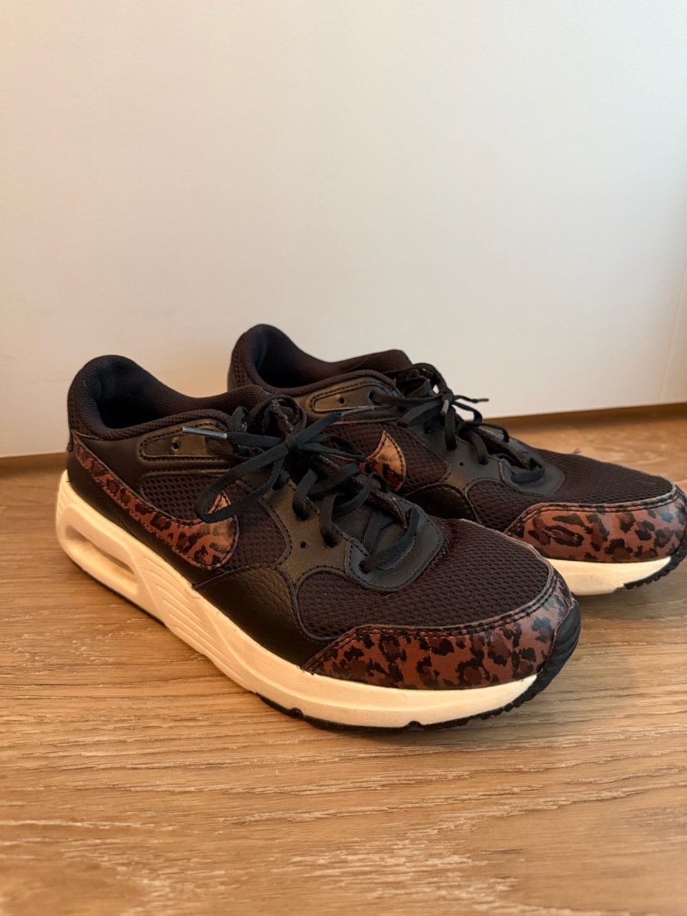 Nike Black Sneakers with Brown Leopard Swoosh Accent